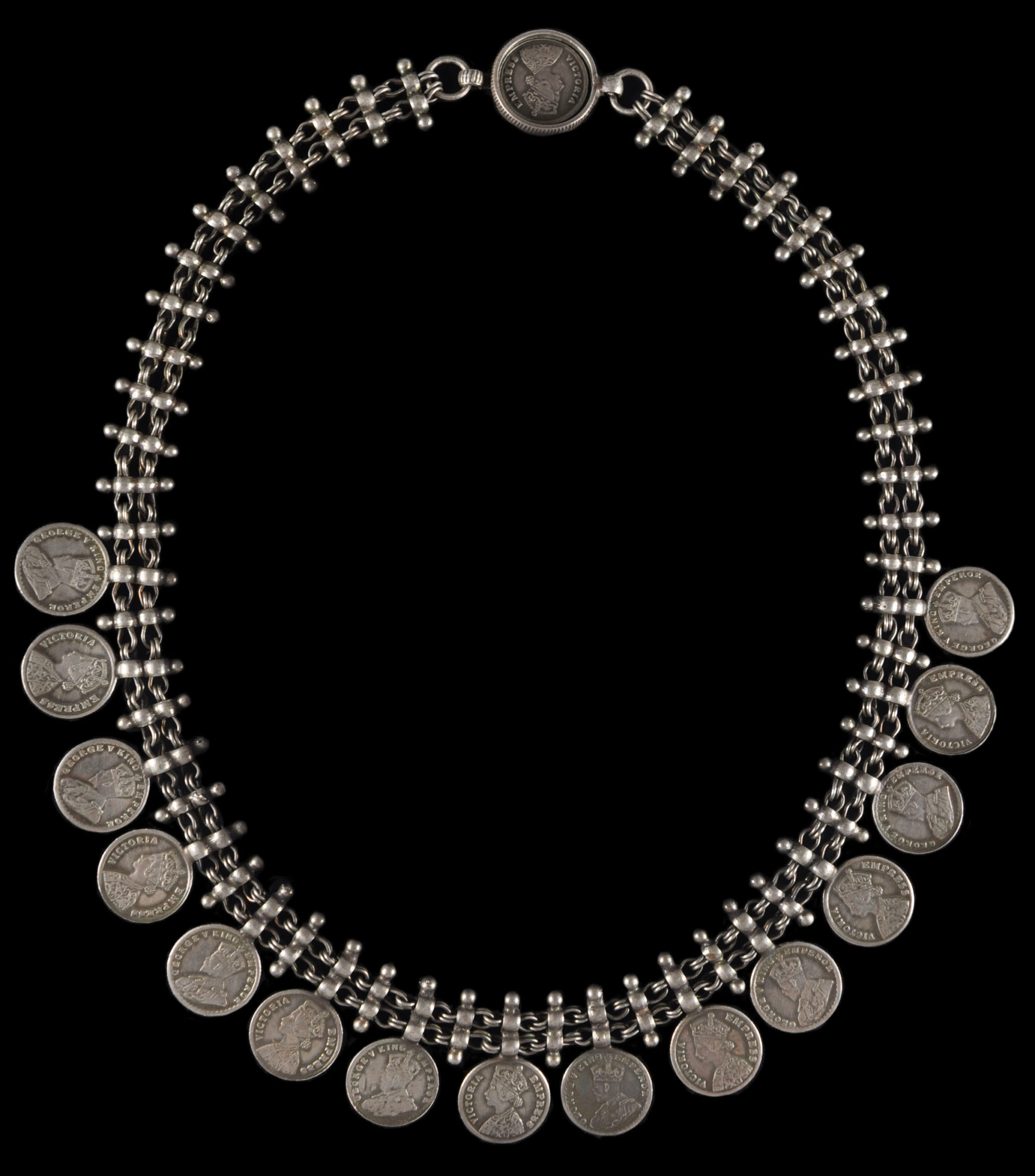 https://www.michaelbackmanltd.com/wp-content/uploads/2019/07/6066-Indian-Silver-Coin-Necklace-10-scaled.jpg